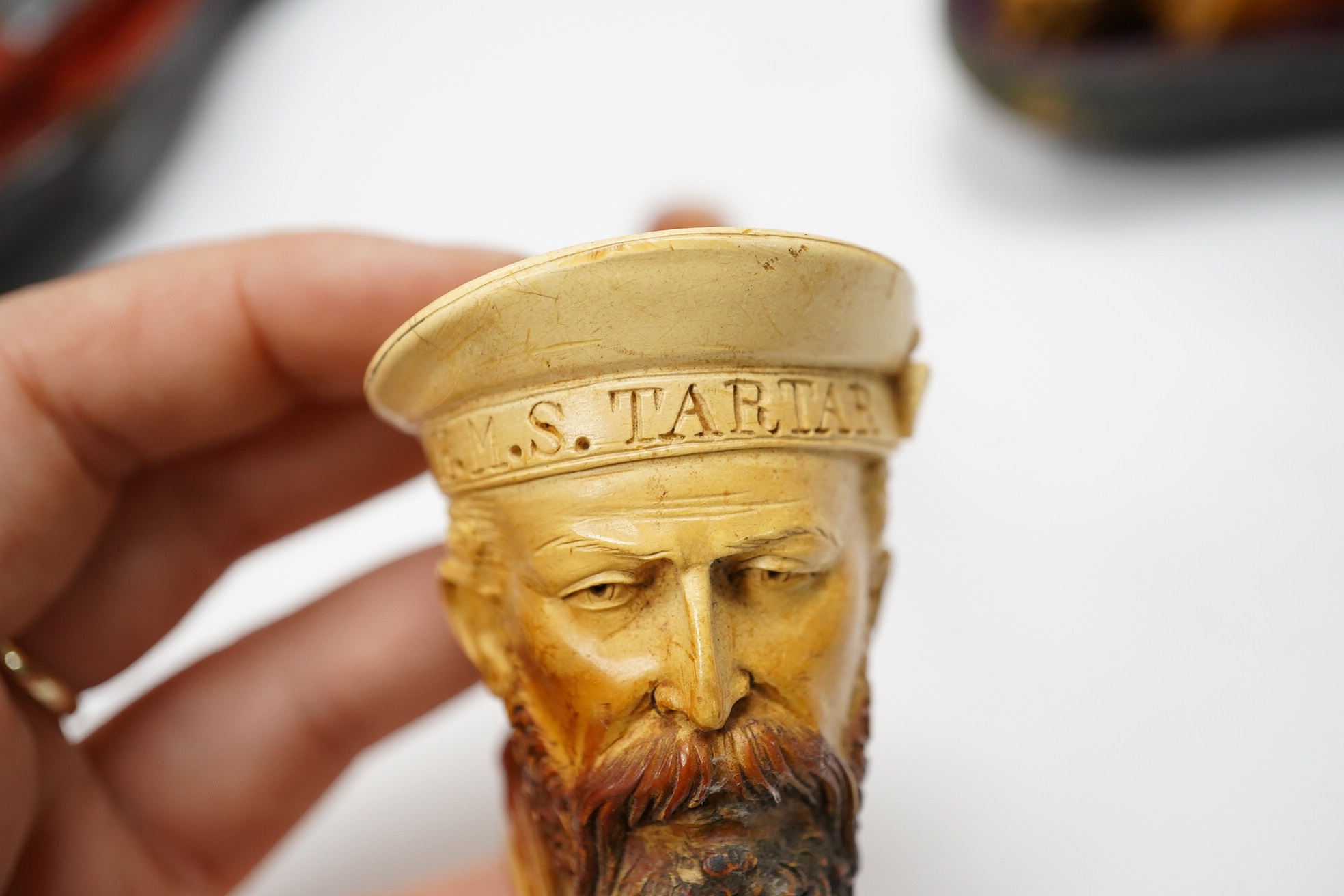 Three cased assorted Meerschaum pipes; sailor, boy on a pole and a Turk, largest Turk 19cm long. Condition - all pipes have damage either in pipe bowls or amber, cases worn